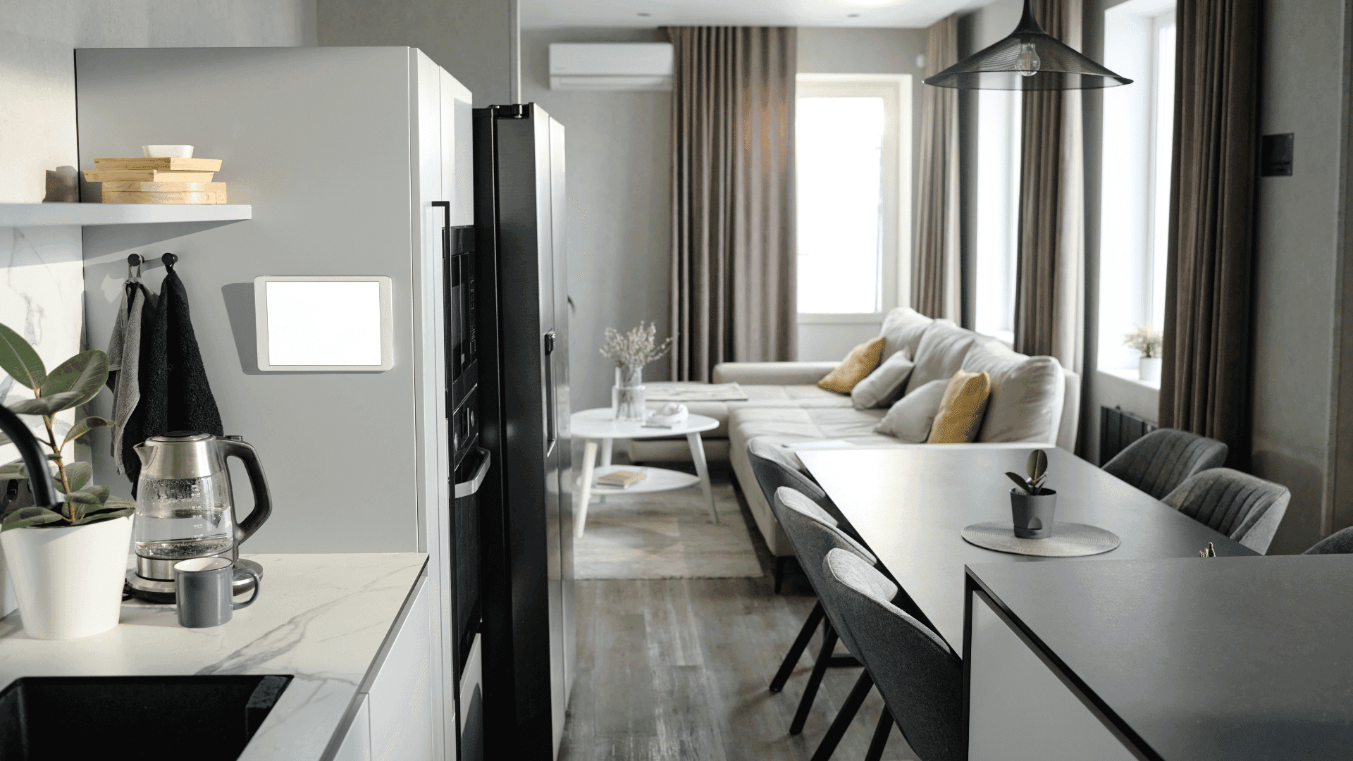 Modern fully furnished room for rent in Bangalore with open kitchen, dining area, and comfortable living space.