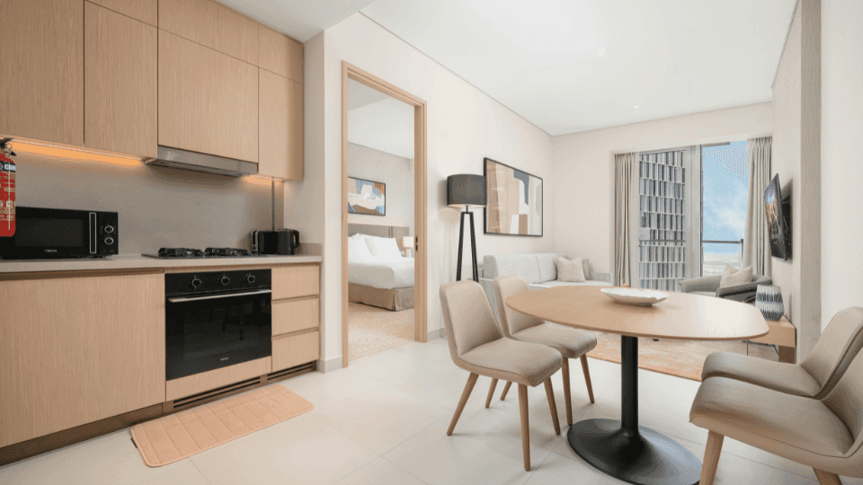 Bright and airy open-plan living and kitchen area at luxury co-living spaces in Pune.