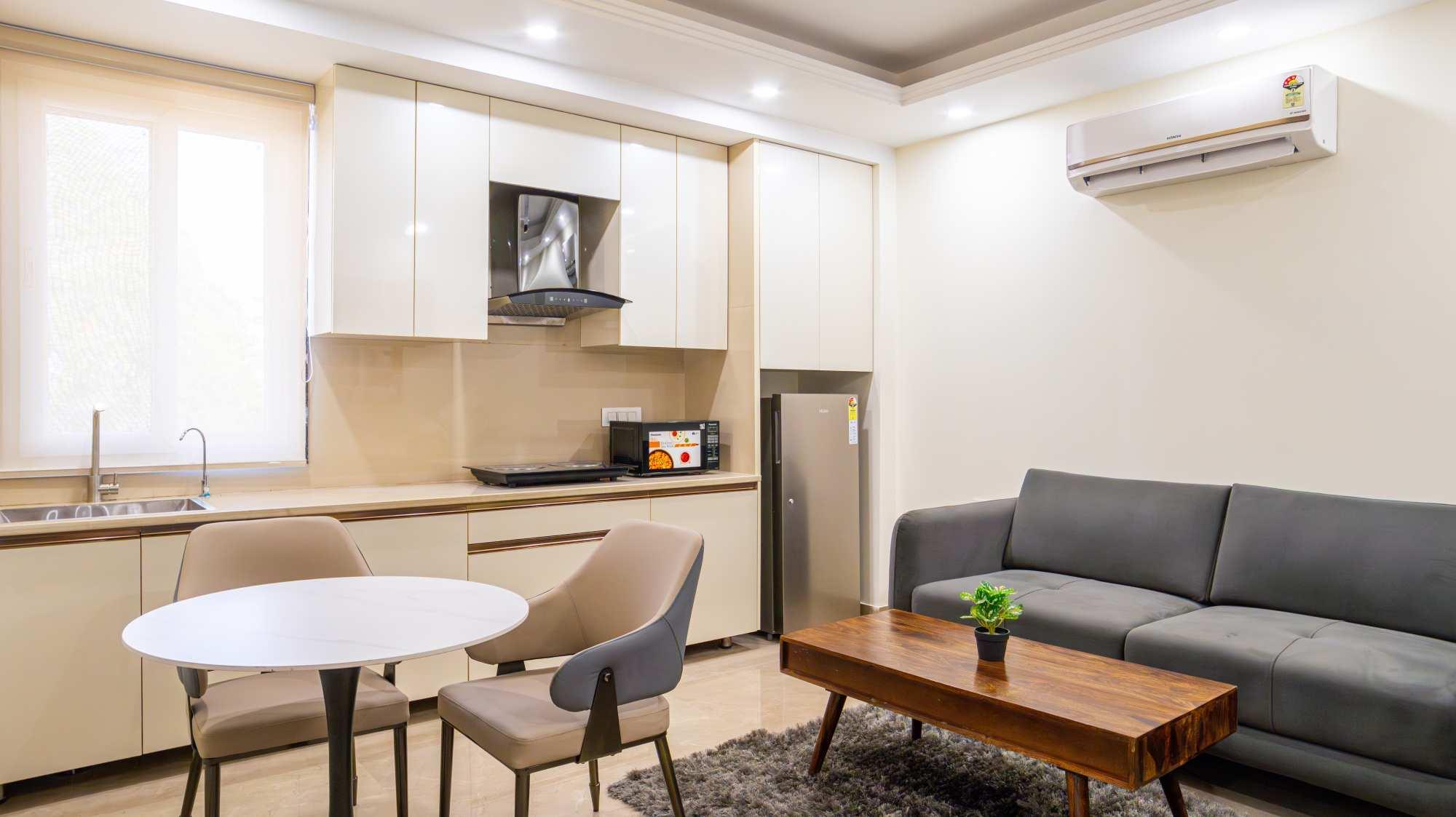 Fully furnished service apartment for rent featuring a modern living room and dining area